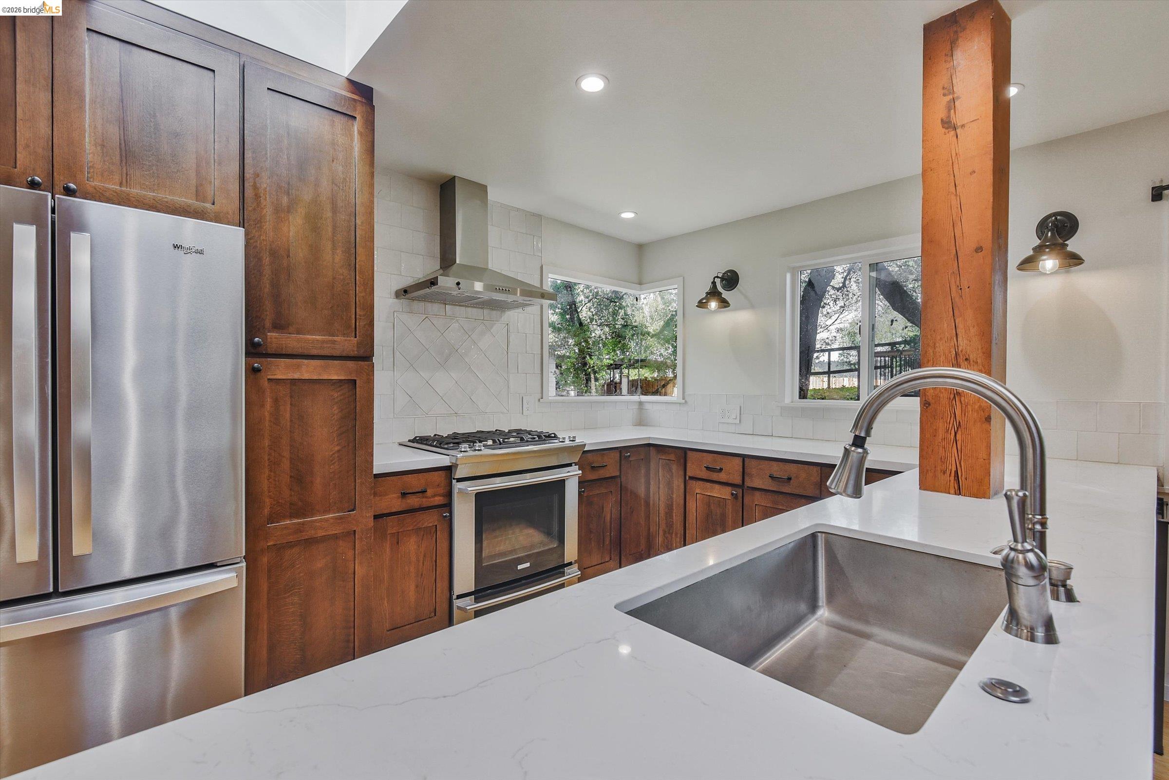 9 Wildwood Road Orinda, CA 94563 - Photo 9 of 34 a kitchen with stainless steel appliances granite countertop a refrigerator sink and stove