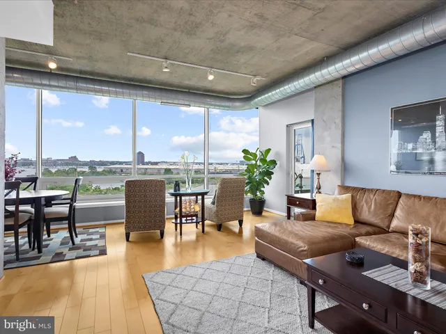 a spacious bathroom with a granite countertop sink a mirror and a shower