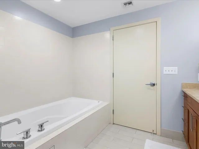 a hallway with cabinets