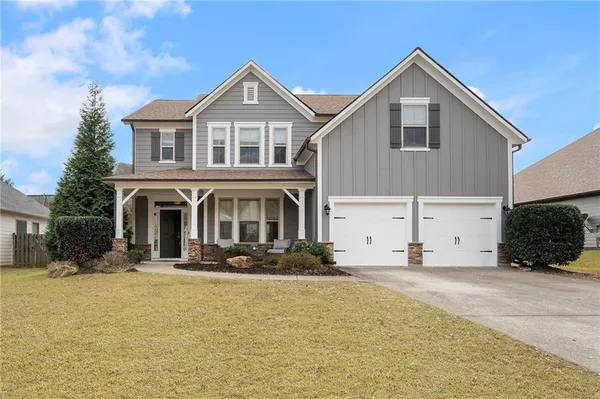 a front view of a house with yard