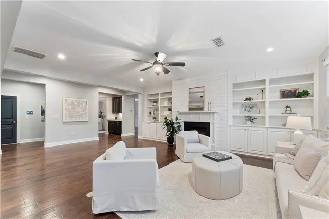 a kitchen with a sink cabinets and wooden floor