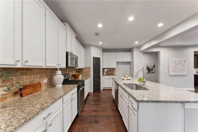 a view of entryway with wooden floor and stairs