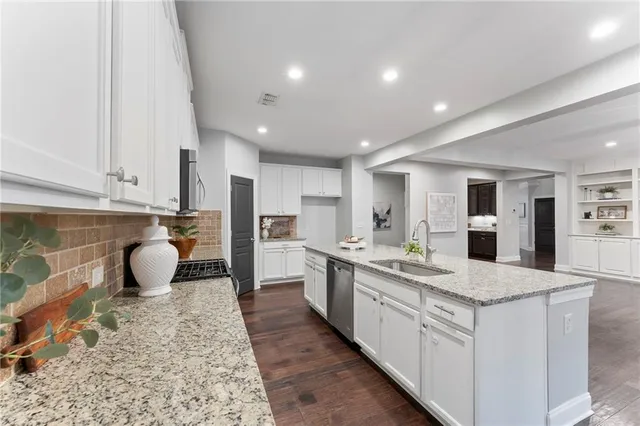 a living room with furniture and a ceiling fan