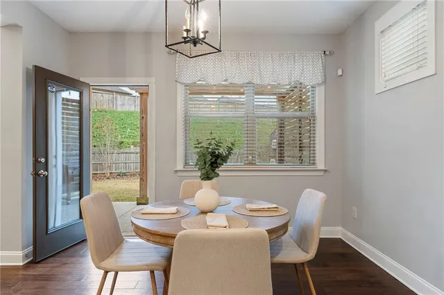 a spacious bedroom with a bed and a chandelier