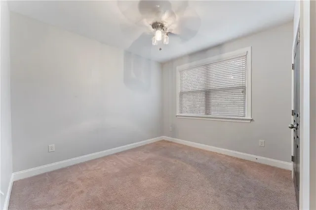 a large bathroom with a tub a sink a mirror and a shower