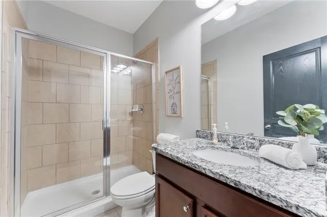 a bathroom with a glass door shower
