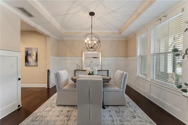 a dining room with furniture potted plants
