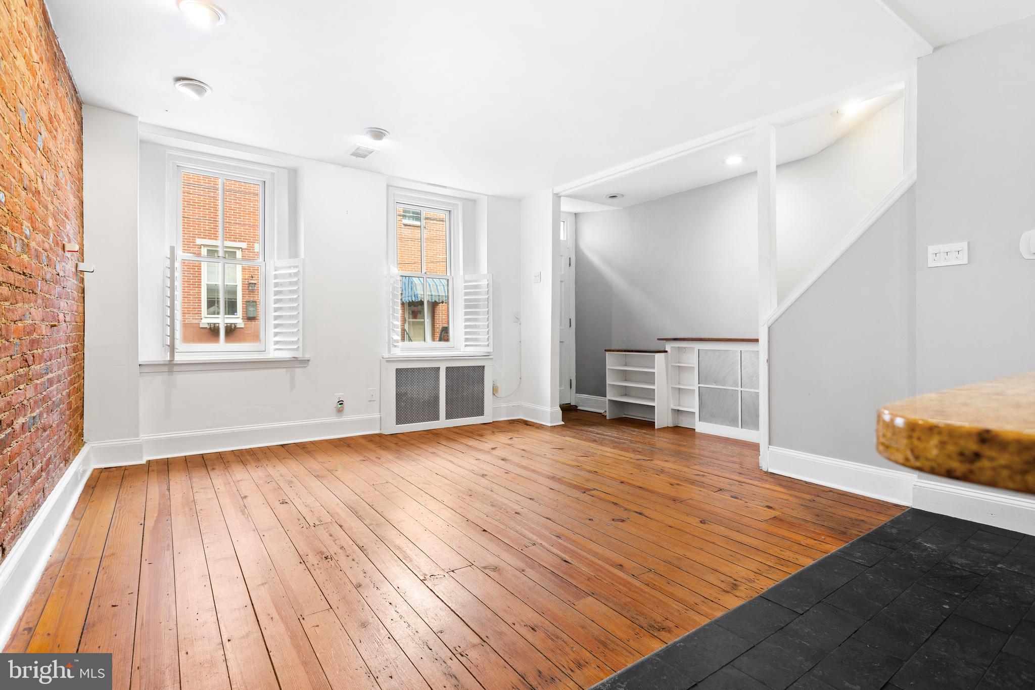 504 Kauffman Street Philadelphia, PA 19147 - Photo 11 of 34 a view of empty room with wooden floor and fan