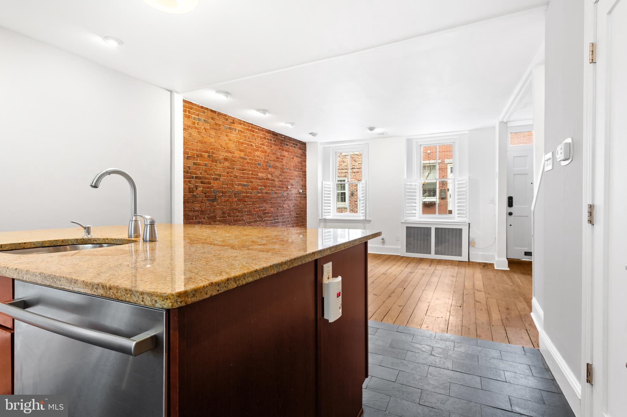 504 Kauffman Street Philadelphia, PA 19147 - Photo 13 of 34 a view of a kitchen counter space with wooden floor