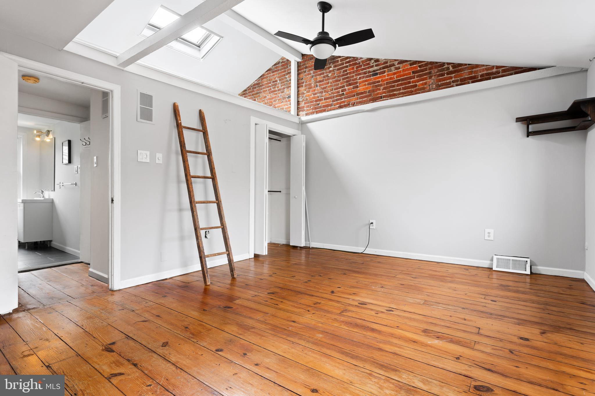 504 Kauffman Street Philadelphia, PA 19147 - Photo 14 of 34 a view of an empty room with wooden floor and a ceiling fan
