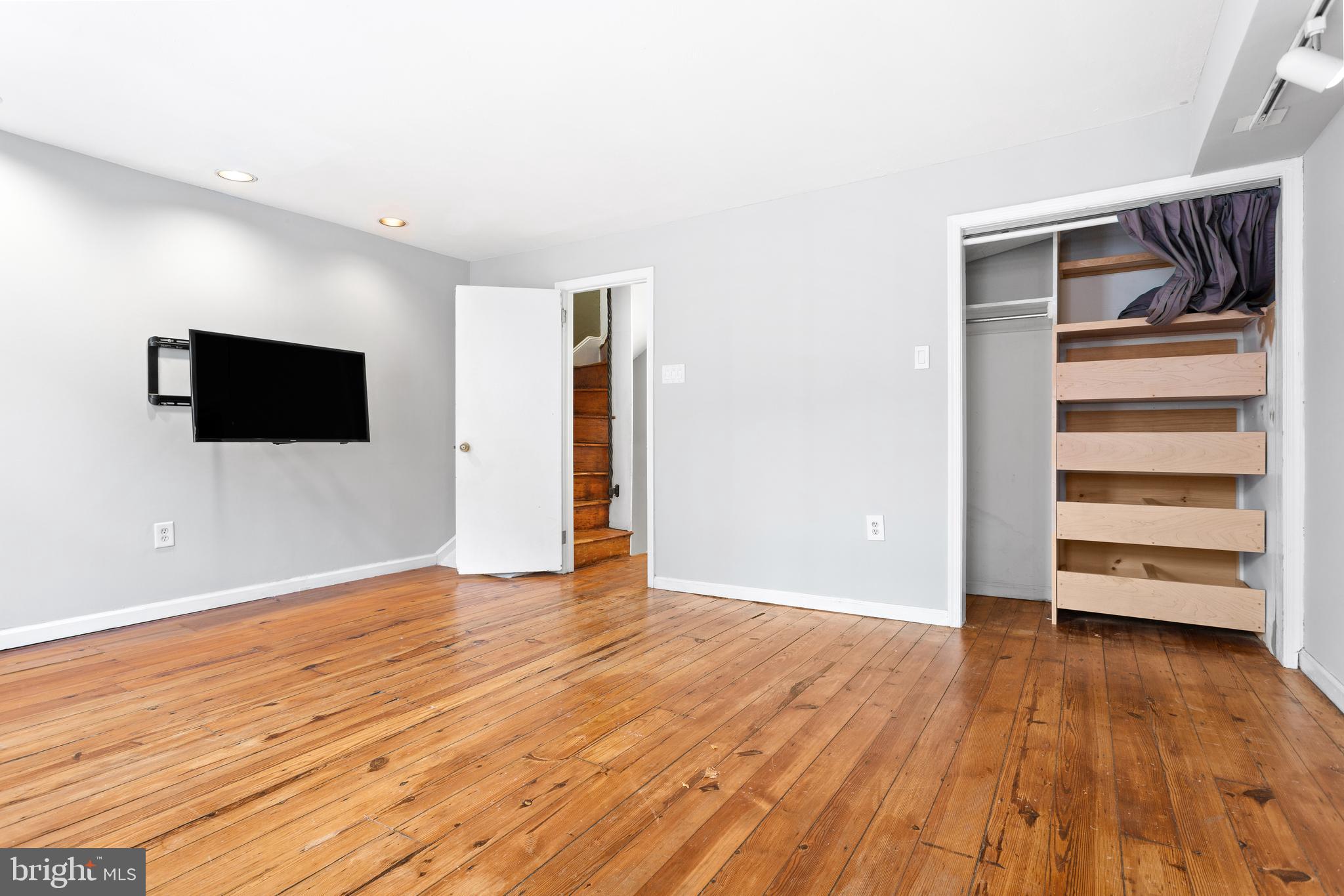 504 Kauffman Street Philadelphia, PA 19147 - Photo 24 of 34 a view of an empty room with wooden floor and windows