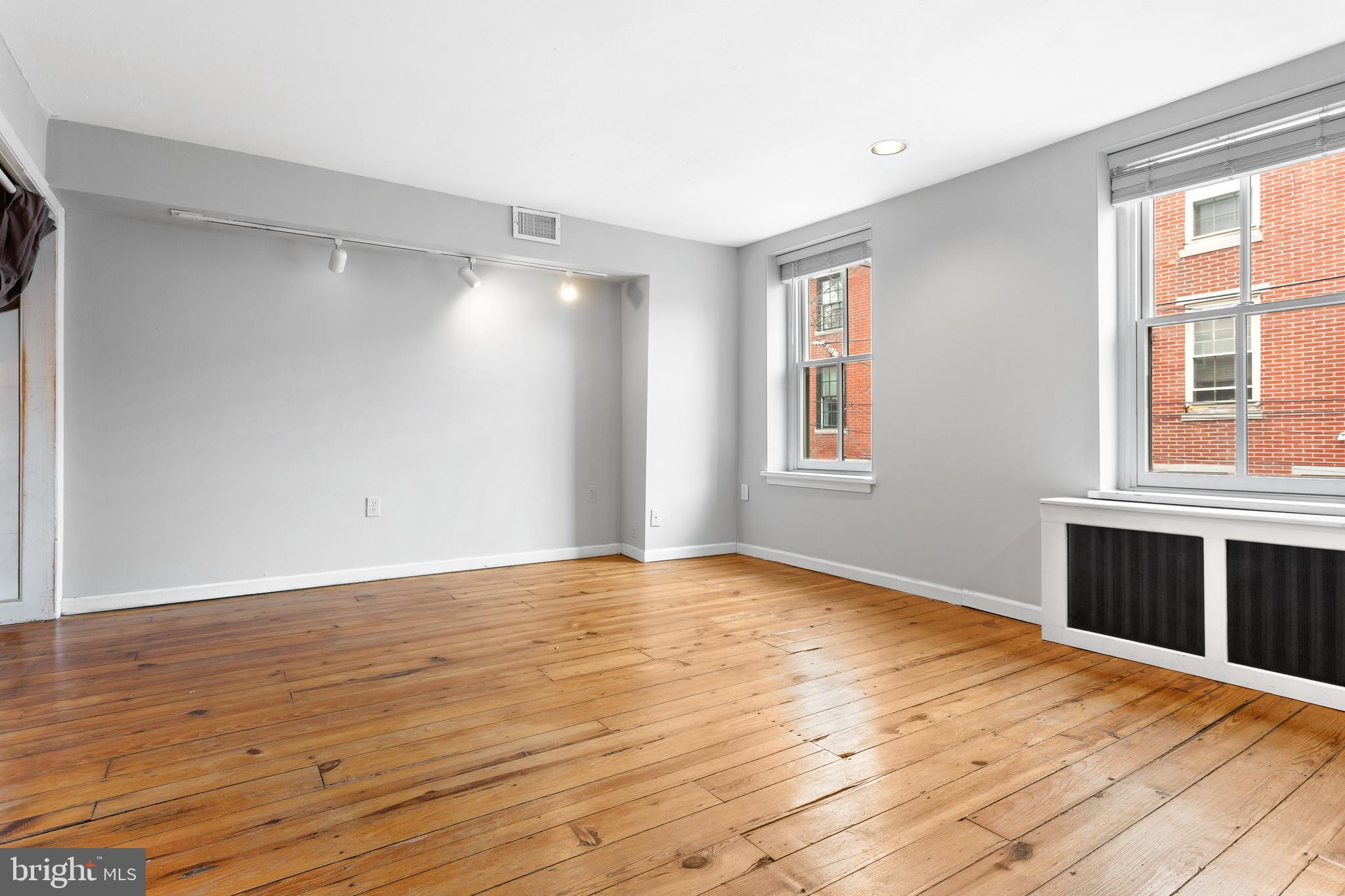 504 Kauffman Street Philadelphia, PA 19147 - Photo 25 of 34 a view of empty room with wooden floor and fan