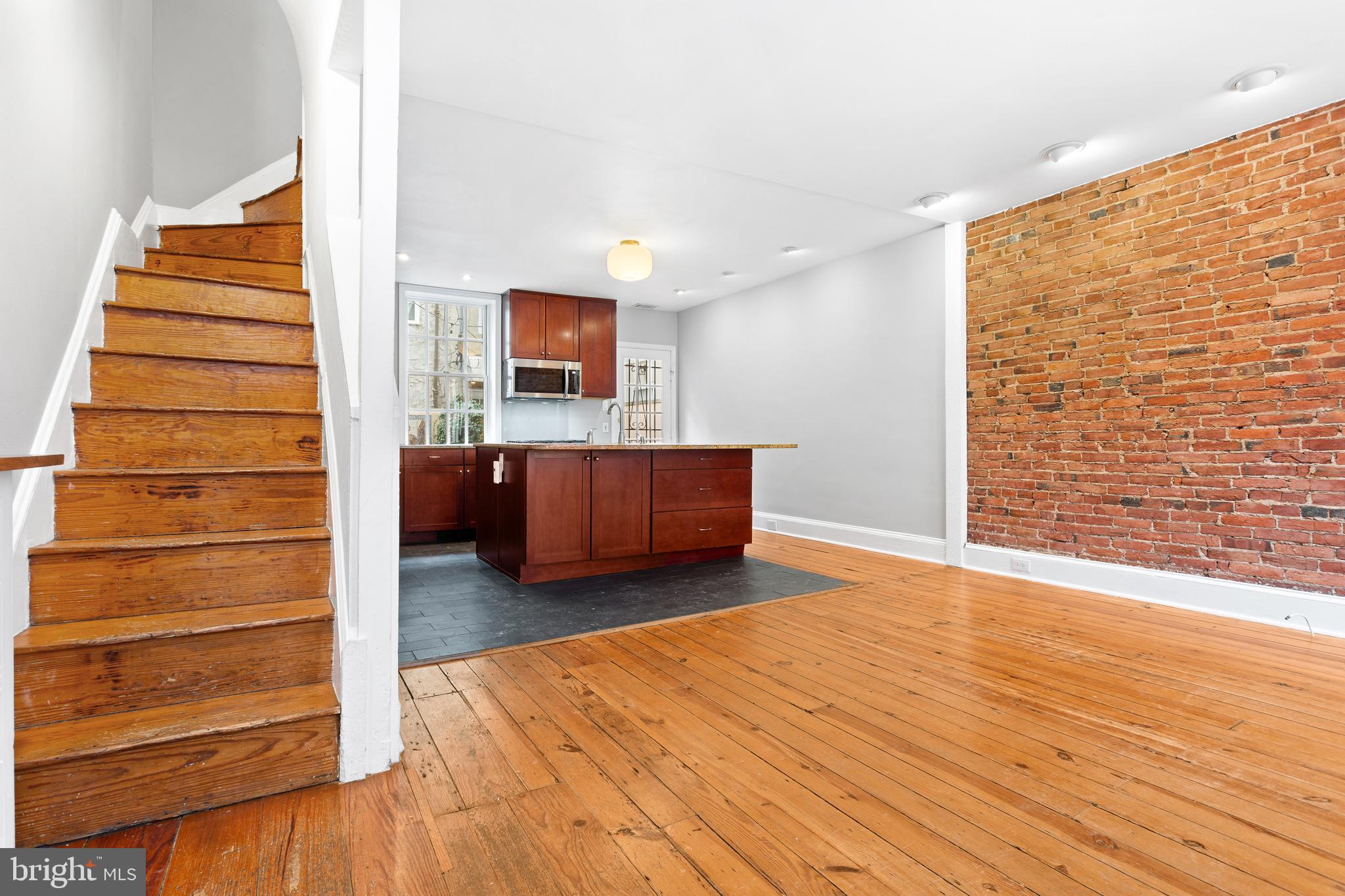 504 Kauffman Street Philadelphia, PA 19147 - Photo 8 of 34 a view of a room with wooden floor and chair