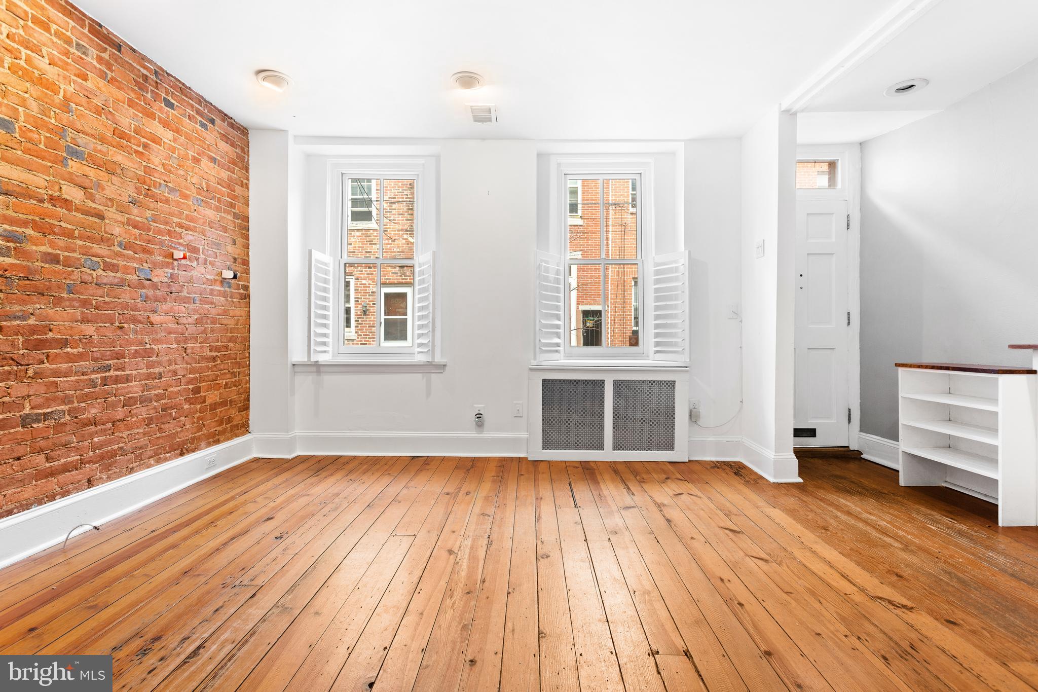 504 Kauffman Street Philadelphia, PA 19147 - Photo 9 of 34 a view of empty room with wooden floor and fan