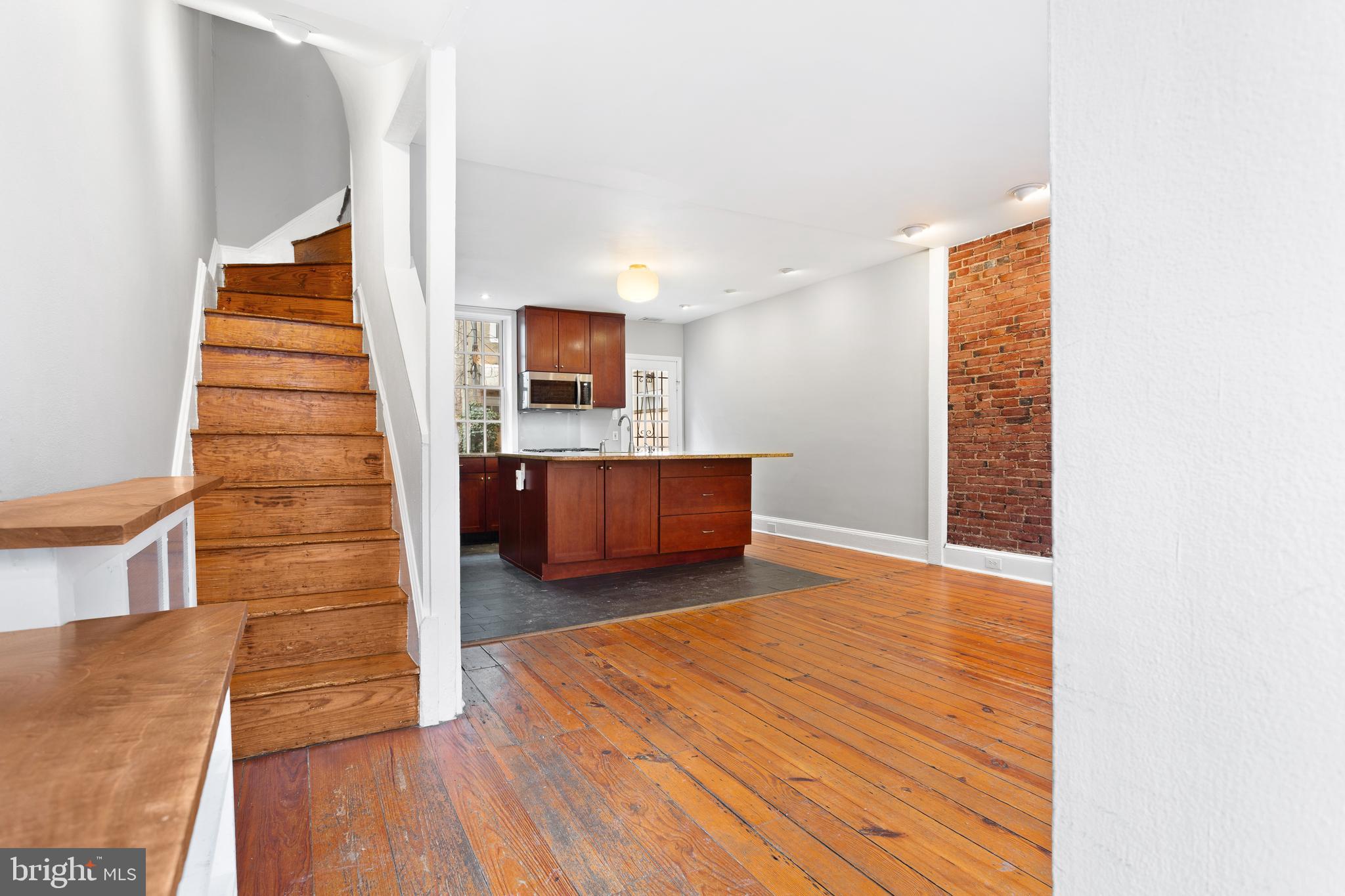 504 Kauffman Street Philadelphia, PA 19147 - Photo 10 of 34 a view of a room with wooden floor and stairs