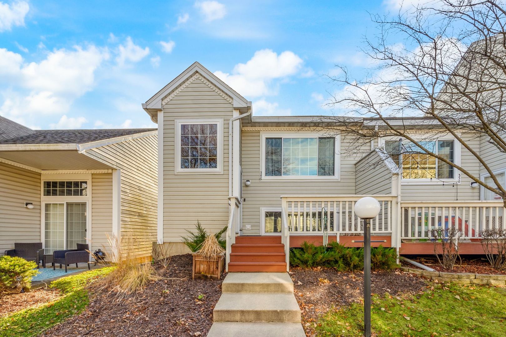346 Springmist Court Bolingbrook, IL 60440 - Photo 1 of 19 a front view of a house with a yard