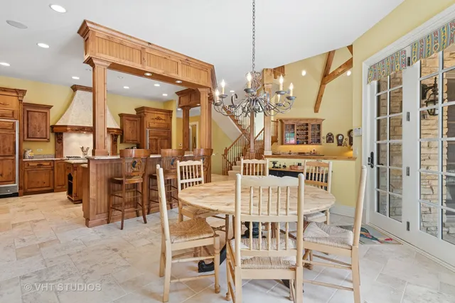 a living room with furniture and floor to ceiling windows