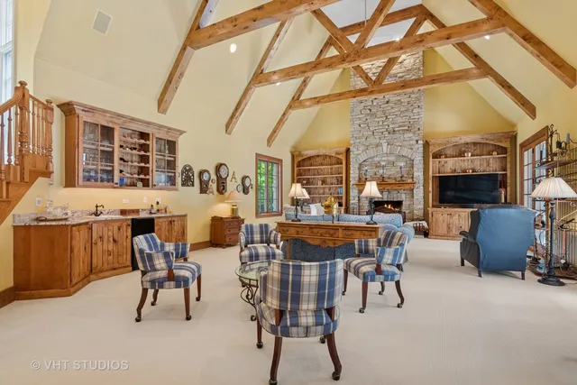 a living room with furniture and large windows