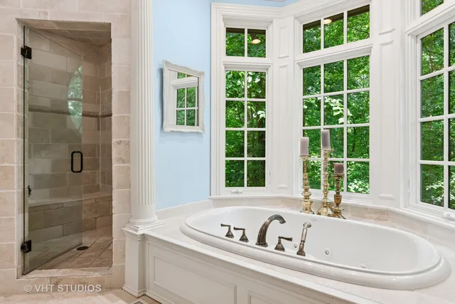 a bathroom with a granite countertop toilet a sink and a bathtub