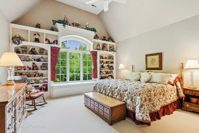 a bedroom with furniture and a flat screen tv
