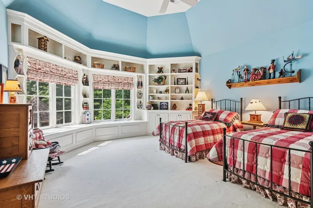 a bathroom with a double vanity sink toilet and shower
