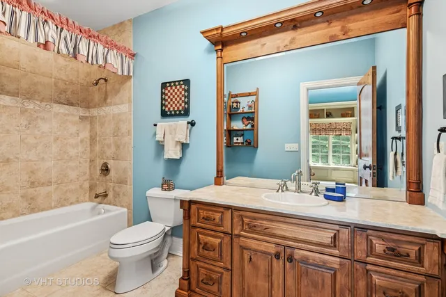 a living room with a table chairs and a dining table