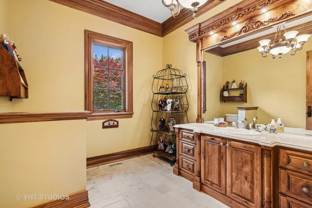 a view of a dining room with furniture and a chandelier
