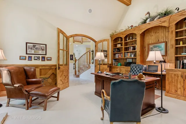 a living room with furniture a patio and a floor to ceiling window