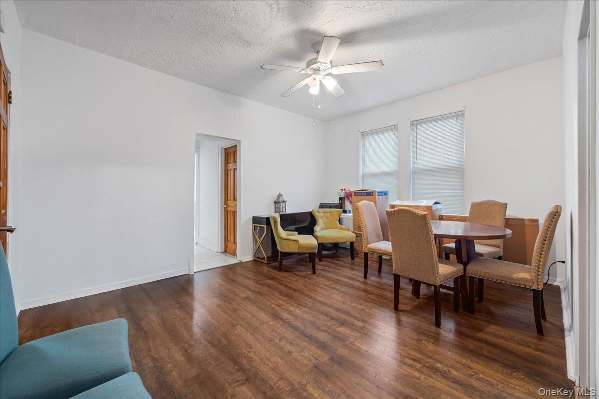 2953 Harding Avenue Bronx, NY 10465 - Photo 11 of 29 Dining space with a textured ceiling, ceiling fan, and wood finished floors