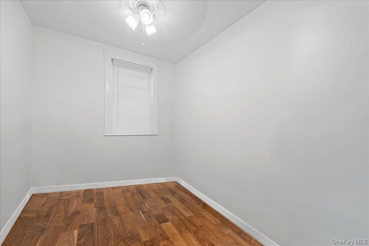 2953 Harding Avenue Bronx, NY 10465 - Photo 16 of 29 Empty room featuring wood finished floors and ceiling fan