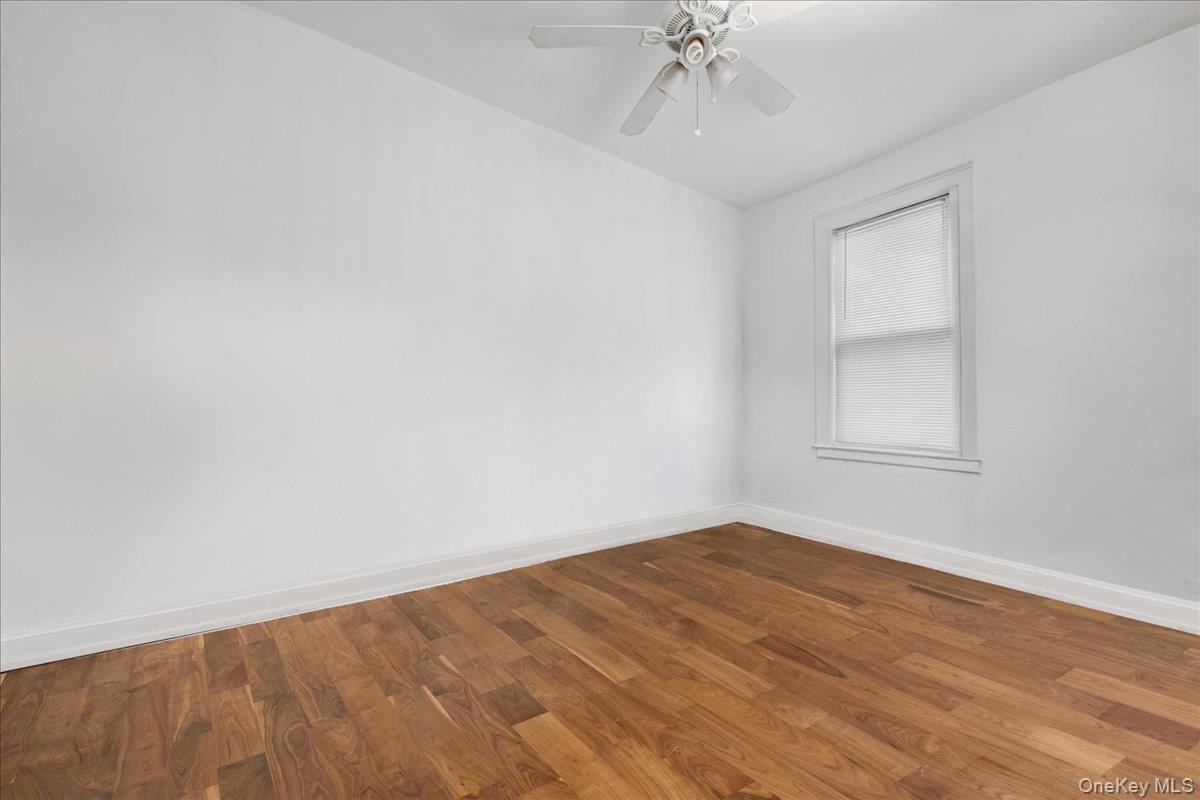 2953 Harding Avenue Bronx, NY 10465 - Photo 17 of 29 Spare room with wood finished floors and a ceiling fan