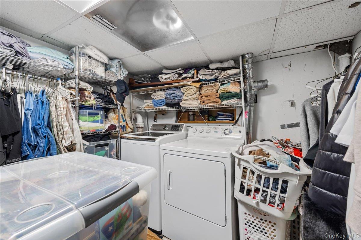 2953 Harding Avenue Bronx, NY 10465 - Photo 23 of 29 Laundry room featuring a drop ceiling and independent washer and dryer