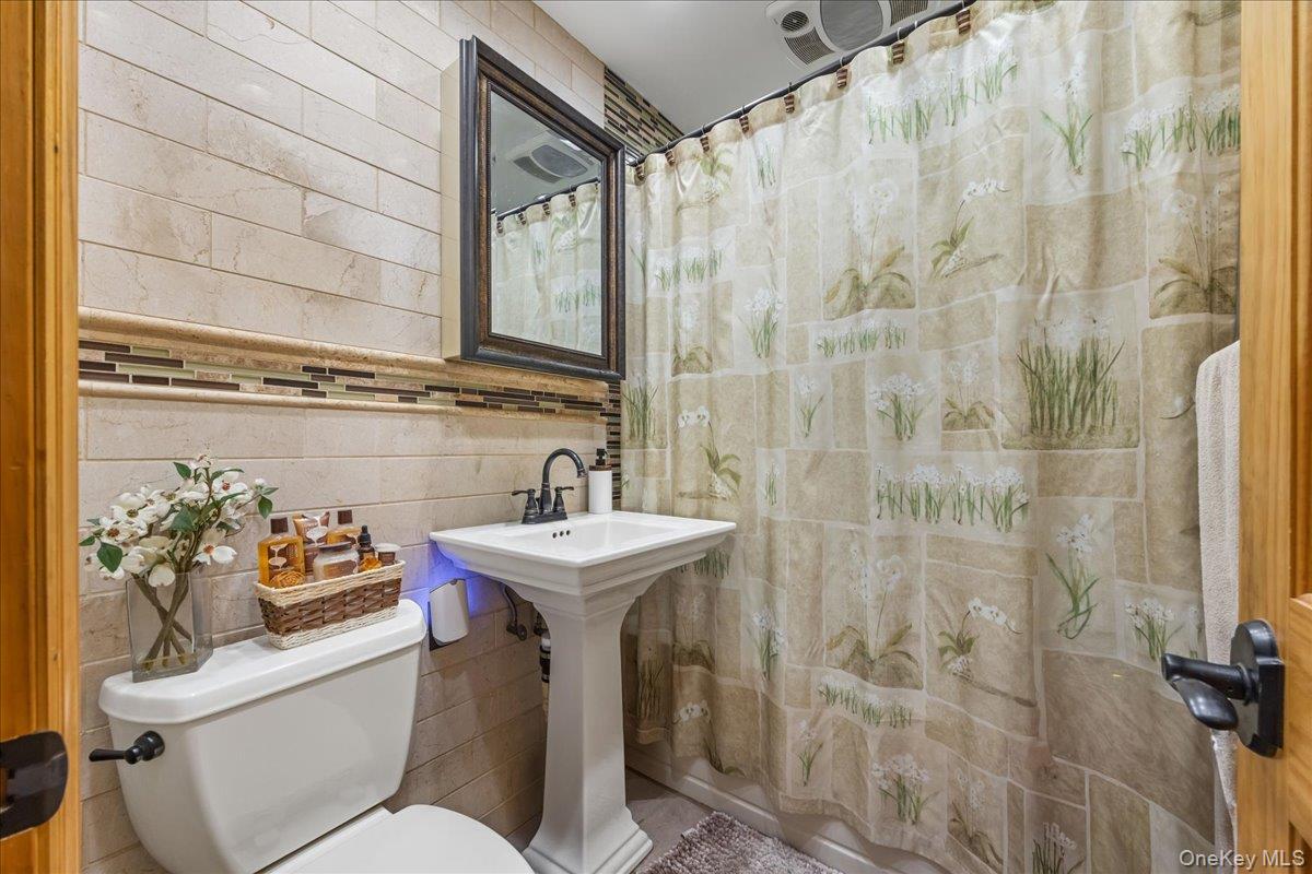 2953 Harding Avenue Bronx, NY 10465 - Photo 8 of 29 Full bath featuring tile walls and toilet