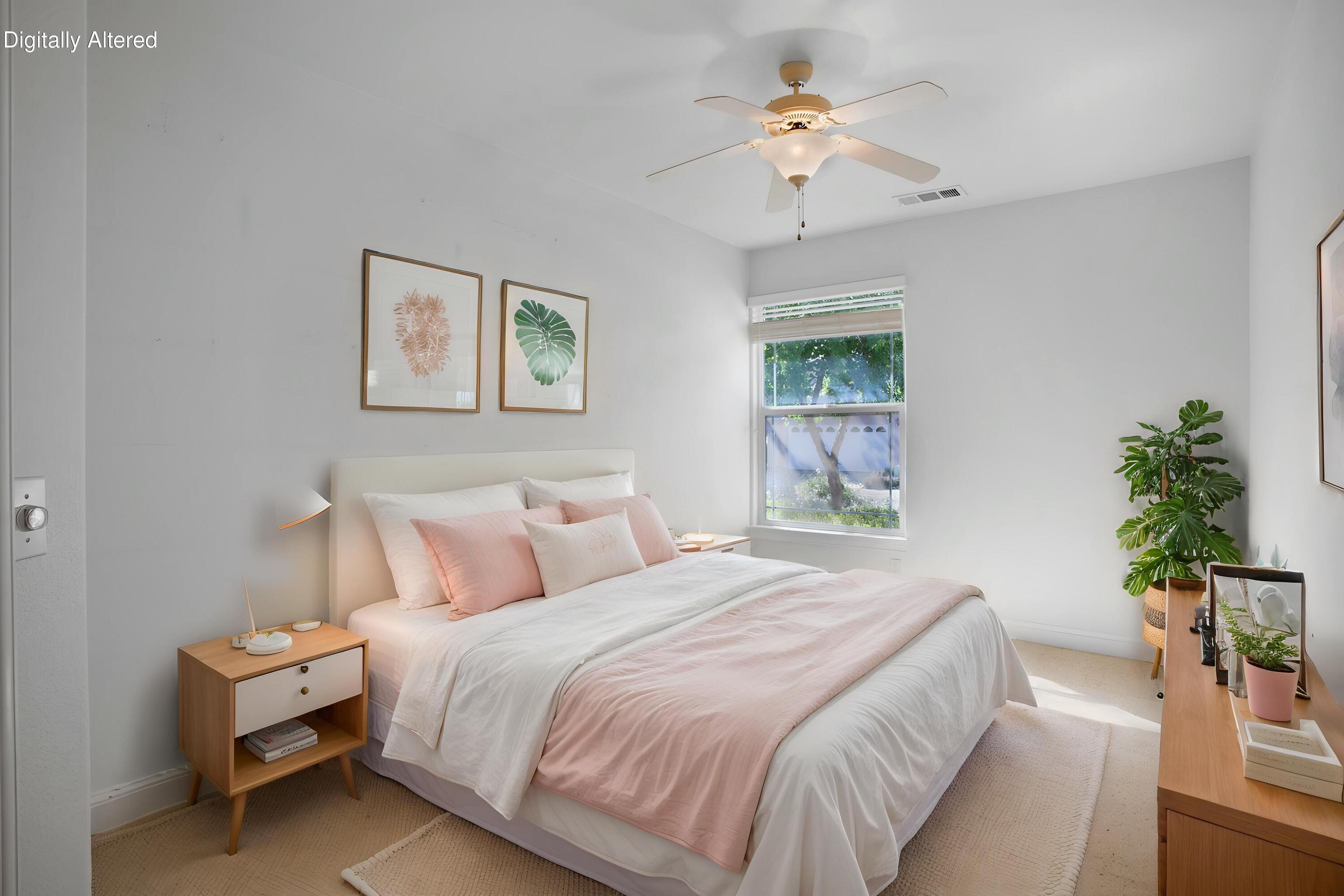 655 Mammoth Path Redding, CA 96003 - Photo 16 of 38 a bedroom with a bed and a chandelier