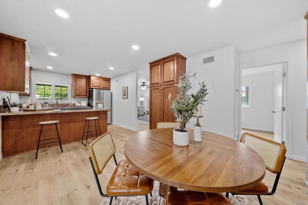 10138 Waynecrest Lane Santee, CA 92071 - Photo 11 of 40 a dining room with furniture and wooden floor
