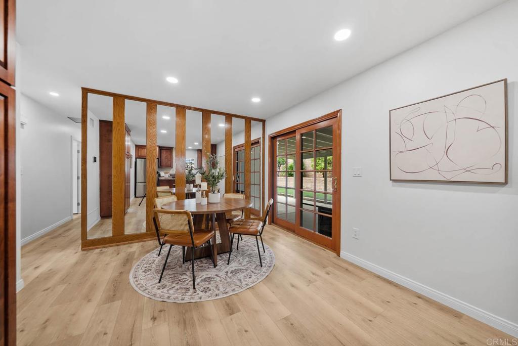 10138 Waynecrest Lane Santee, CA 92071 - Photo 12 of 40 a view of a dining room with furniture window and wooden floor