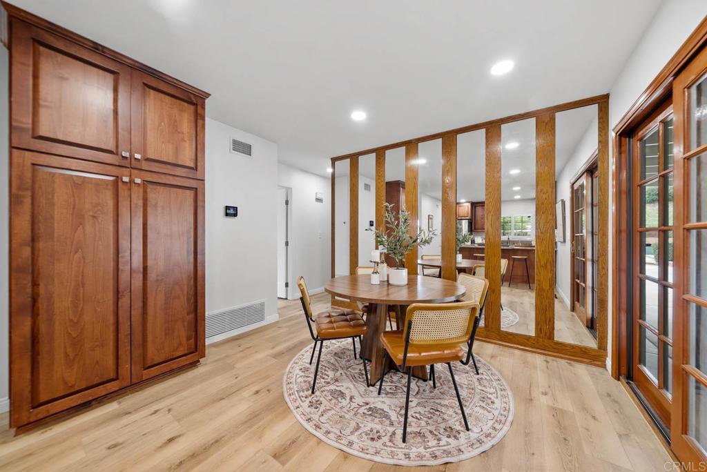 10138 Waynecrest Lane Santee, CA 92071 - Photo 13 of 40 a dining room with furniture water view and wooden floor