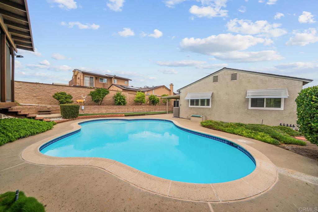 10138 Waynecrest Lane Santee, CA 92071 - Photo 14 of 40 a swimming pool with outdoor seating and yard