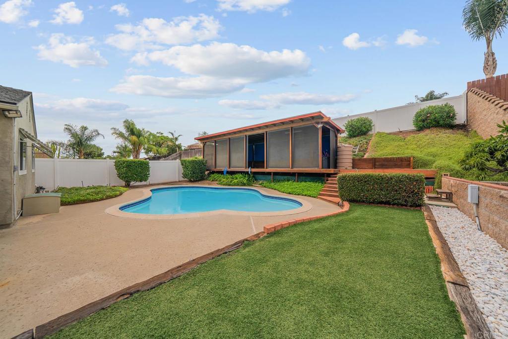 10138 Waynecrest Lane Santee, CA 92071 - Photo 15 of 40 a view of an house with swimming pool and yard