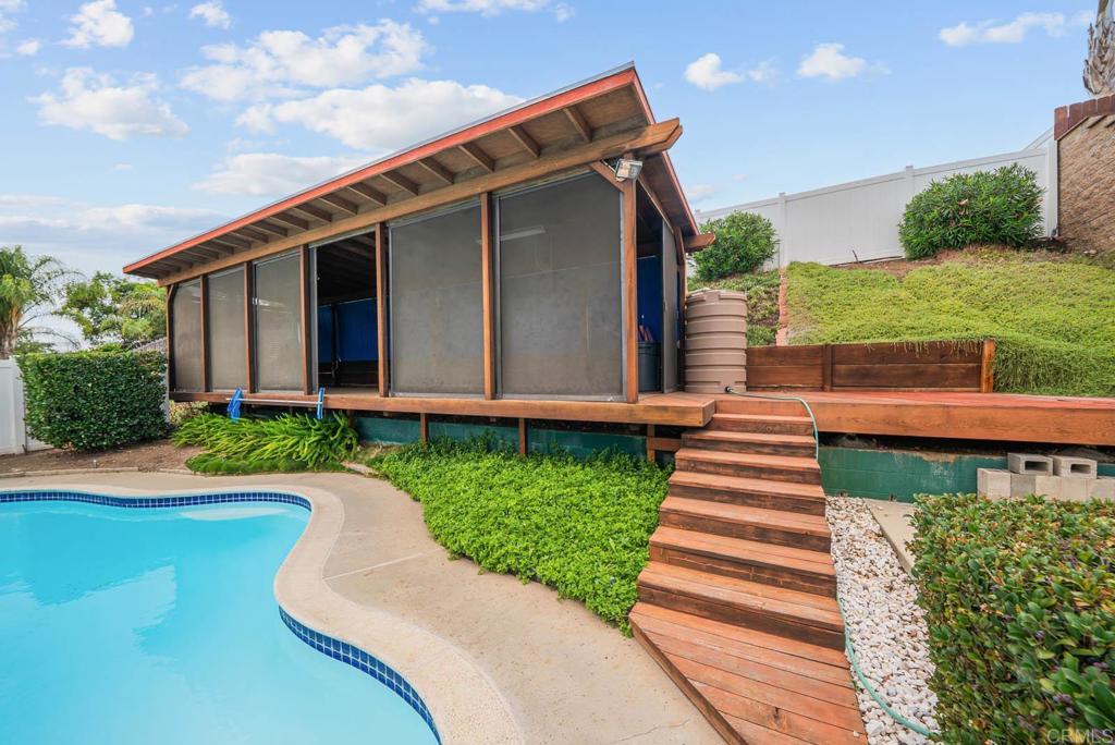 10138 Waynecrest Lane Santee, CA 92071 - Photo 17 of 40 a front view of a house with a yard and potted plants