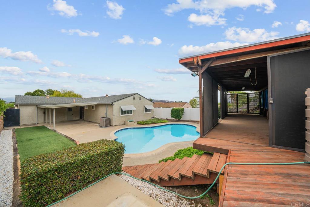 10138 Waynecrest Lane Santee, CA 92071 - Photo 19 of 40 a view of a house with swimming pool and sitting area
