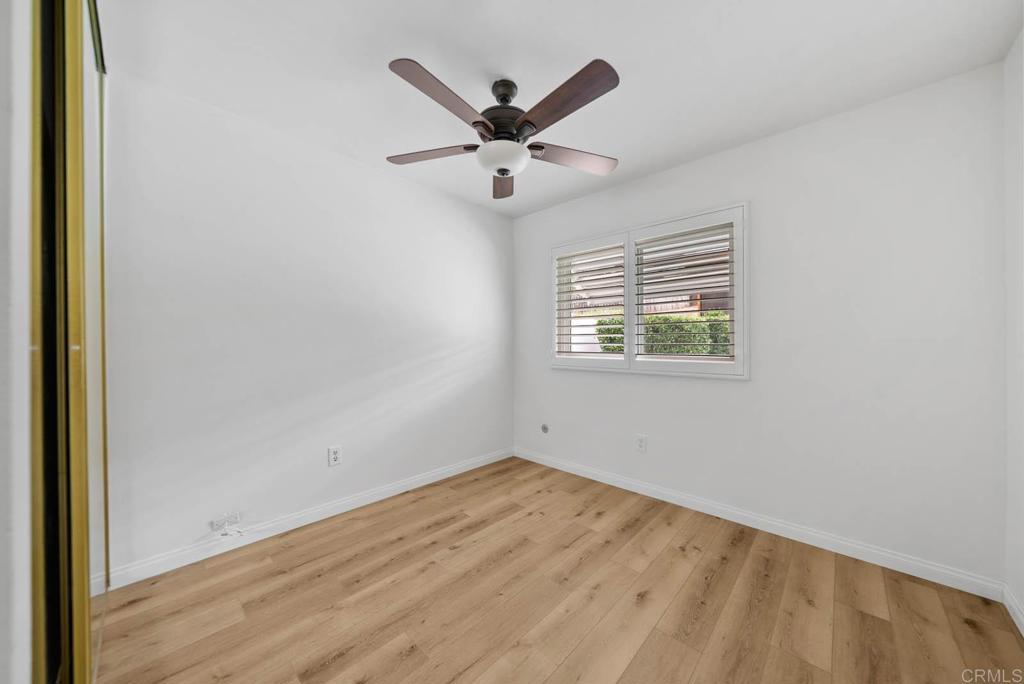 10138 Waynecrest Lane Santee, CA 92071 - Photo 34 of 40 an empty room with ceiling fan and window