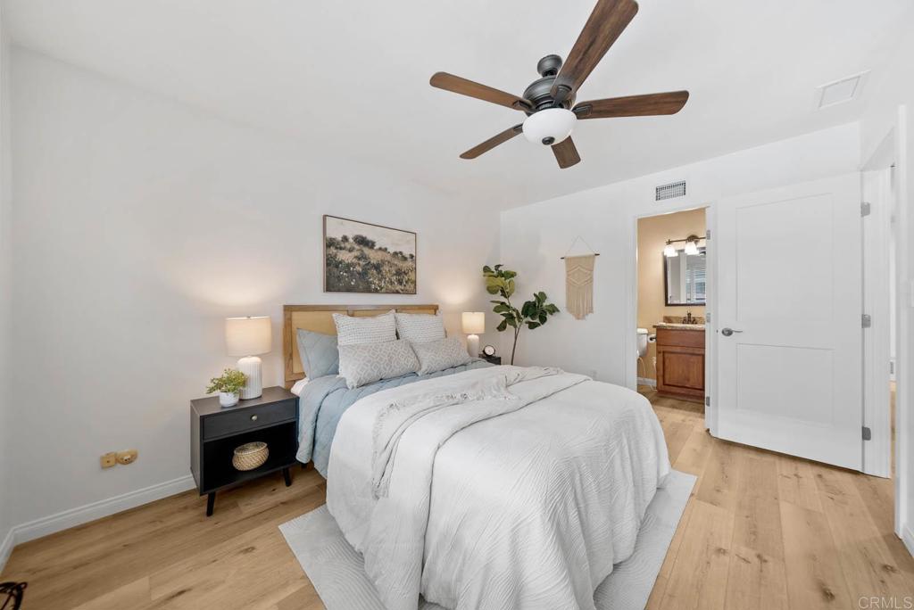 10138 Waynecrest Lane Santee, CA 92071 - Photo 37 of 40 a bedroom with a bed and wooden floor