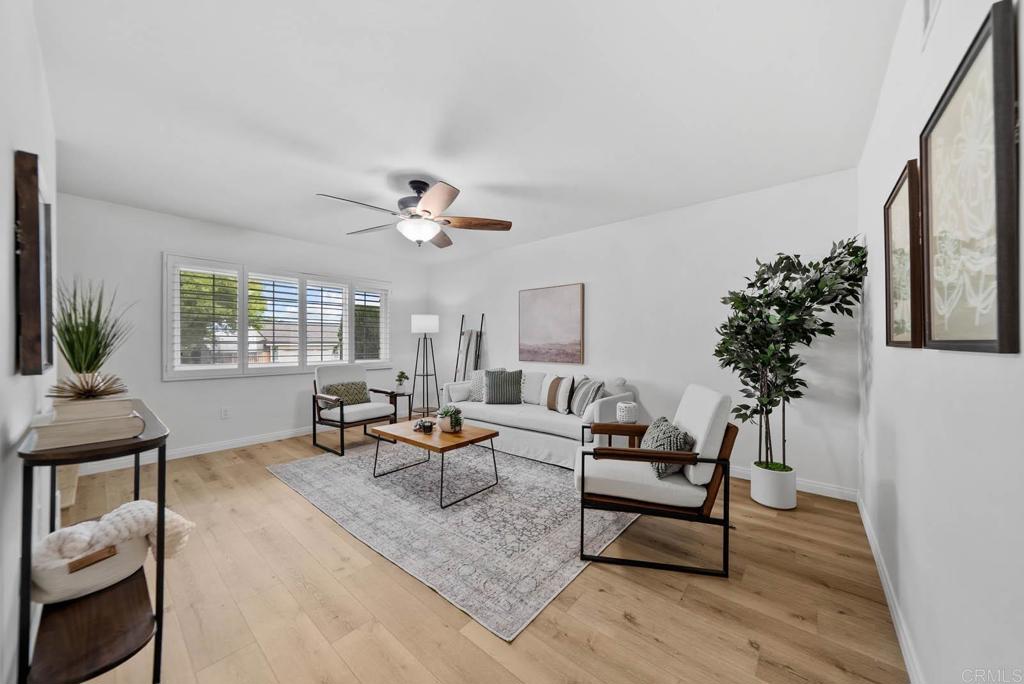 10138 Waynecrest Lane Santee, CA 92071 - Photo 6 of 40 a living room with furniture and a potted plant