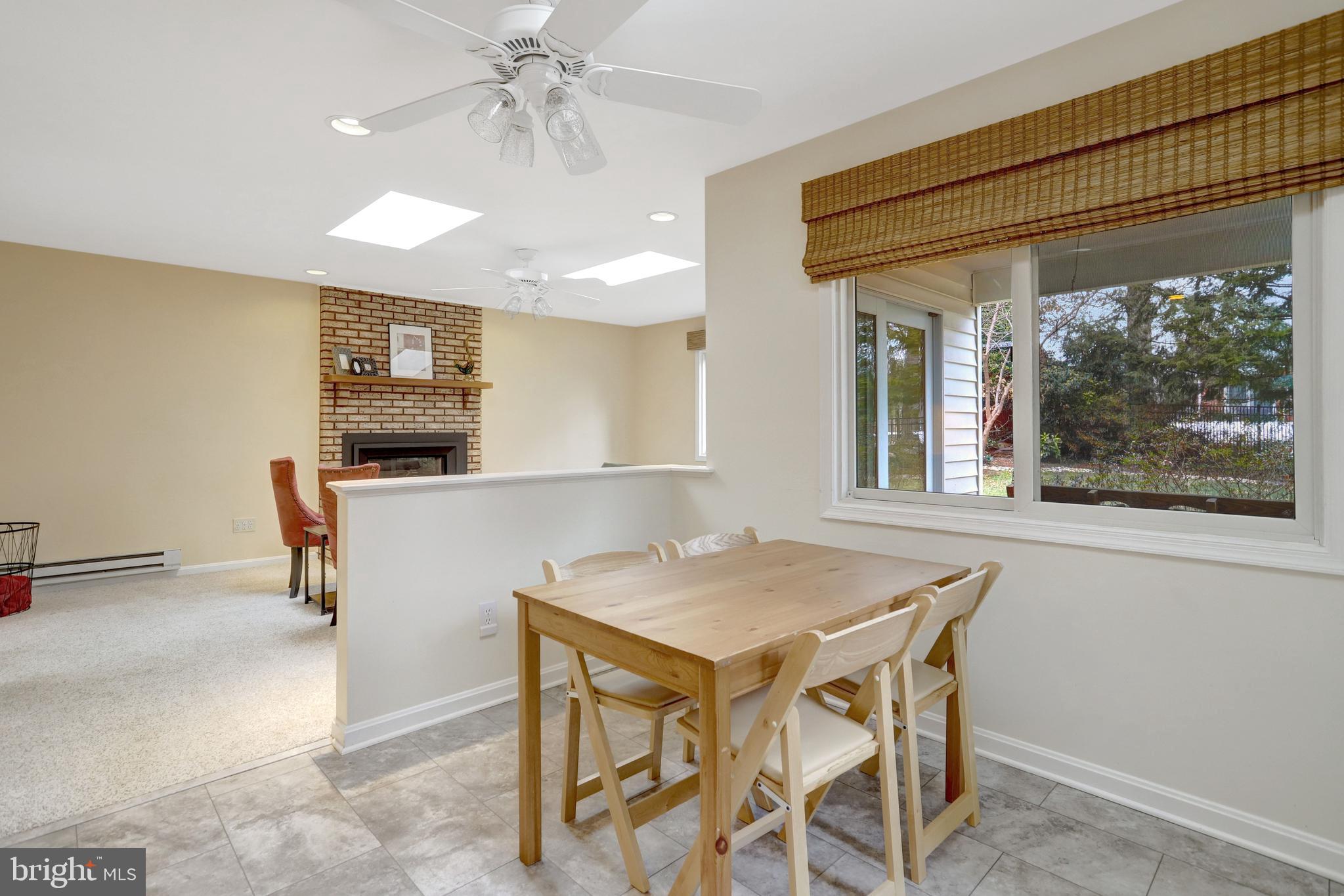 8816 Victoria Road Springfield, VA 22151 - Photo 14 of 76 a view of a dining room with furniture window and outside view