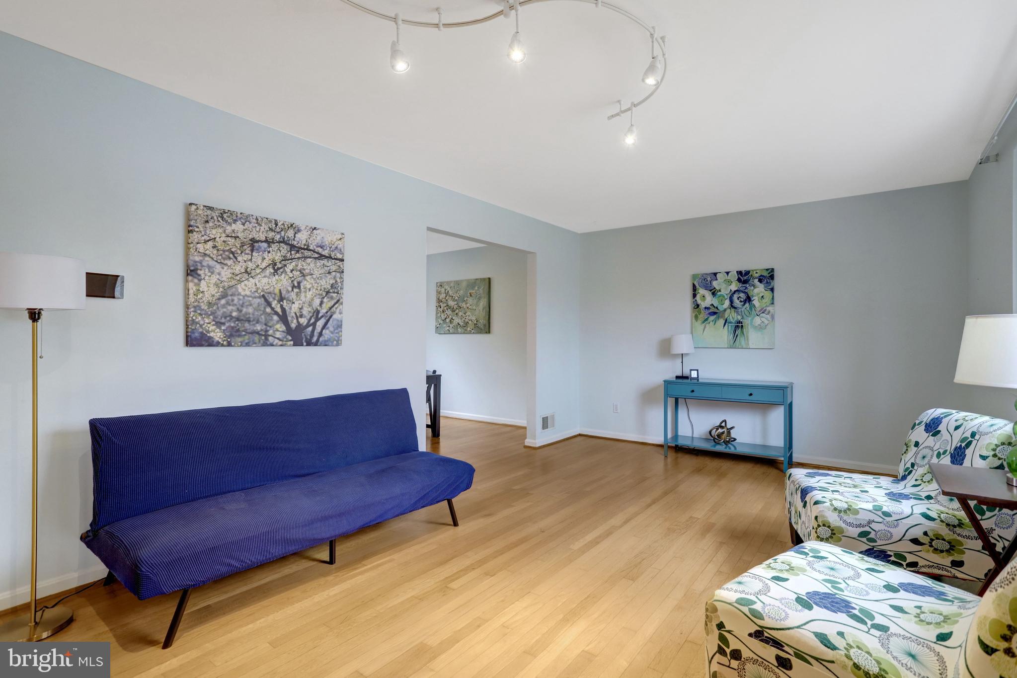 8816 Victoria Road Springfield, VA 22151 - Photo 27 of 76 a bedroom with a bed and a couch