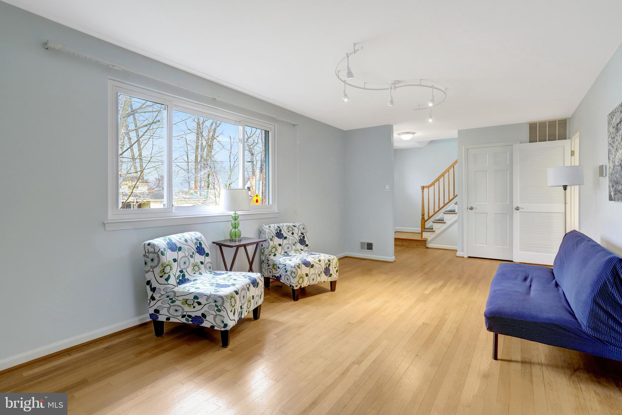 8816 Victoria Road Springfield, VA 22151 - Photo 29 of 76 a living room with furniture and a large window