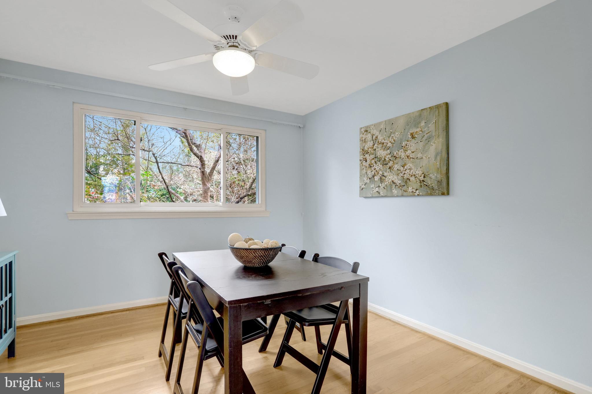 8816 Victoria Road Springfield, VA 22151 - Photo 30 of 76 a view of a dining room with furniture window and wooden floor