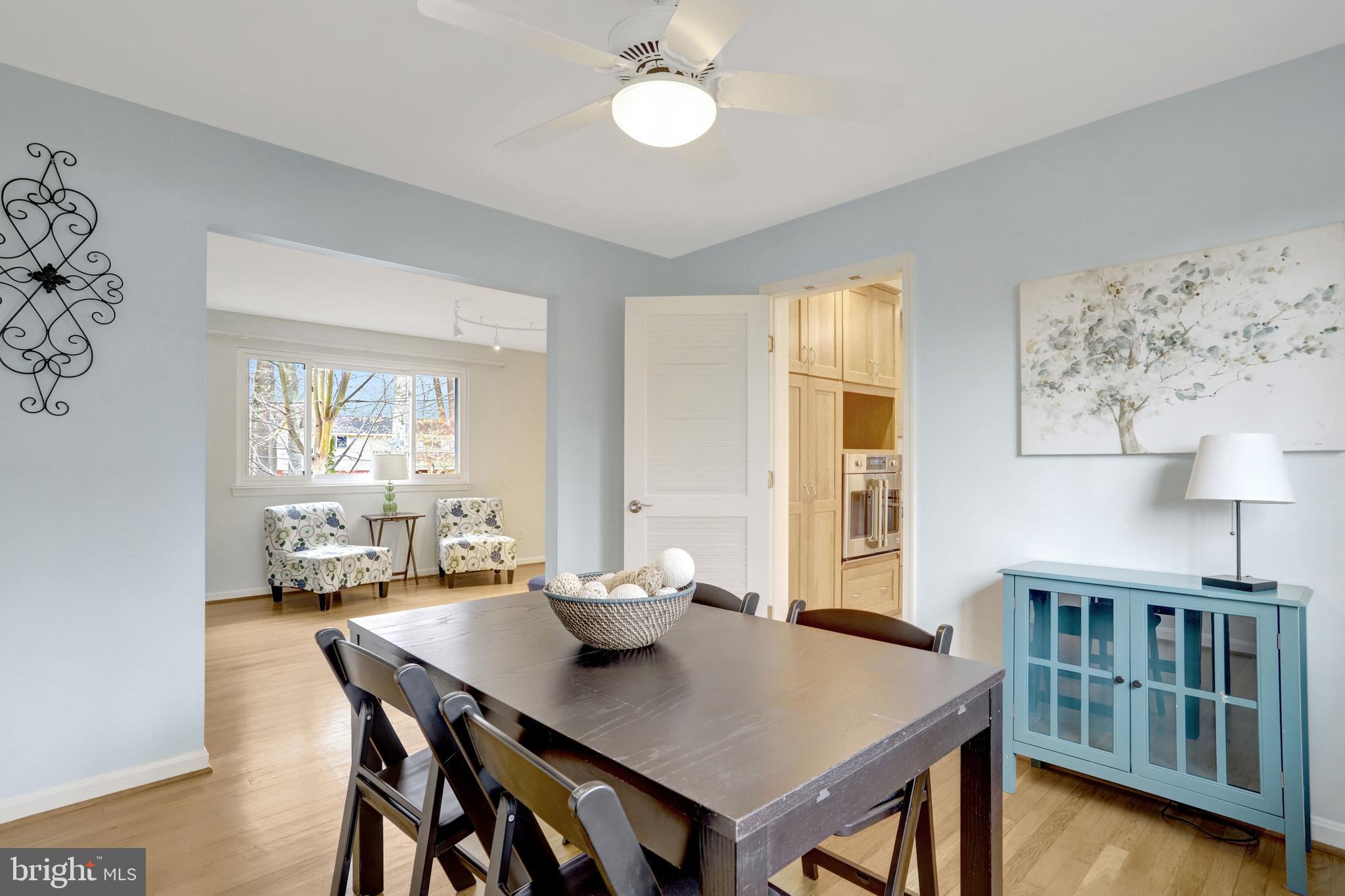 8816 Victoria Road Springfield, VA 22151 - Photo 32 of 76 a view of a dining room with furniture and a window