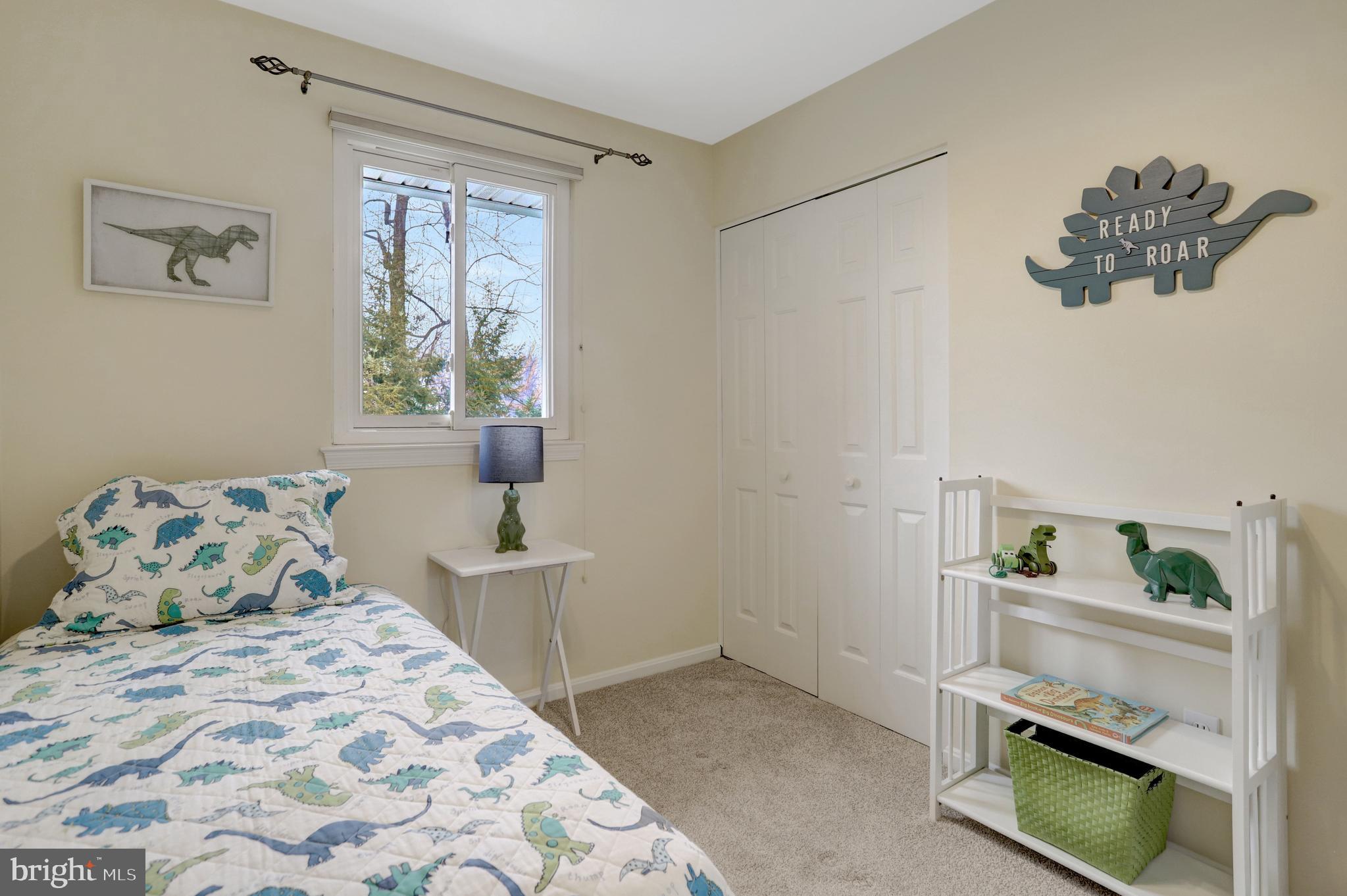 8816 Victoria Road Springfield, VA 22151 - Photo 37 of 76 a bedroom with a bed and window